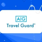 Traveler reviewing Travel Guard insurance options on a laptop in 2025